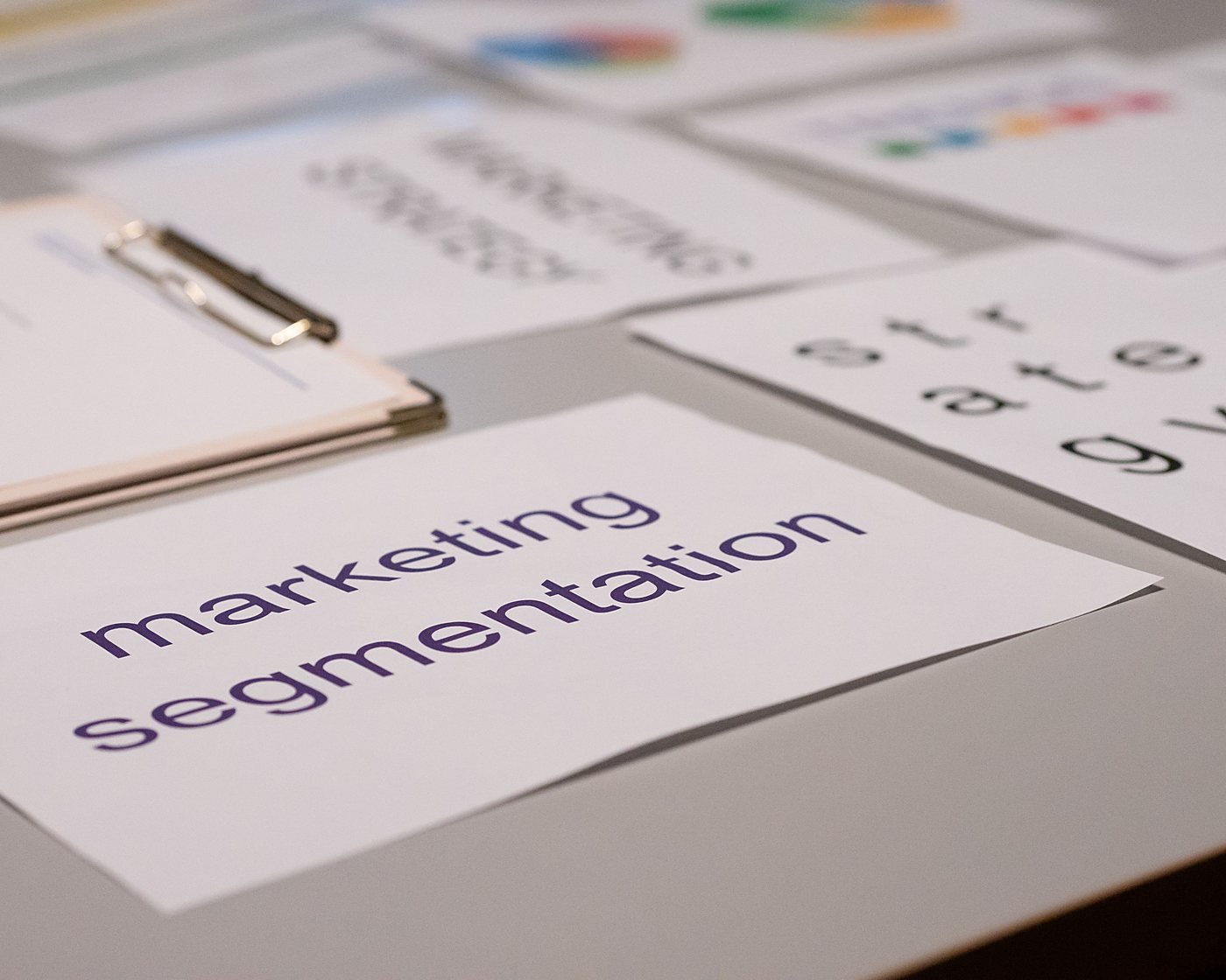 Marketing segmentation and strategy notes spread across a desk